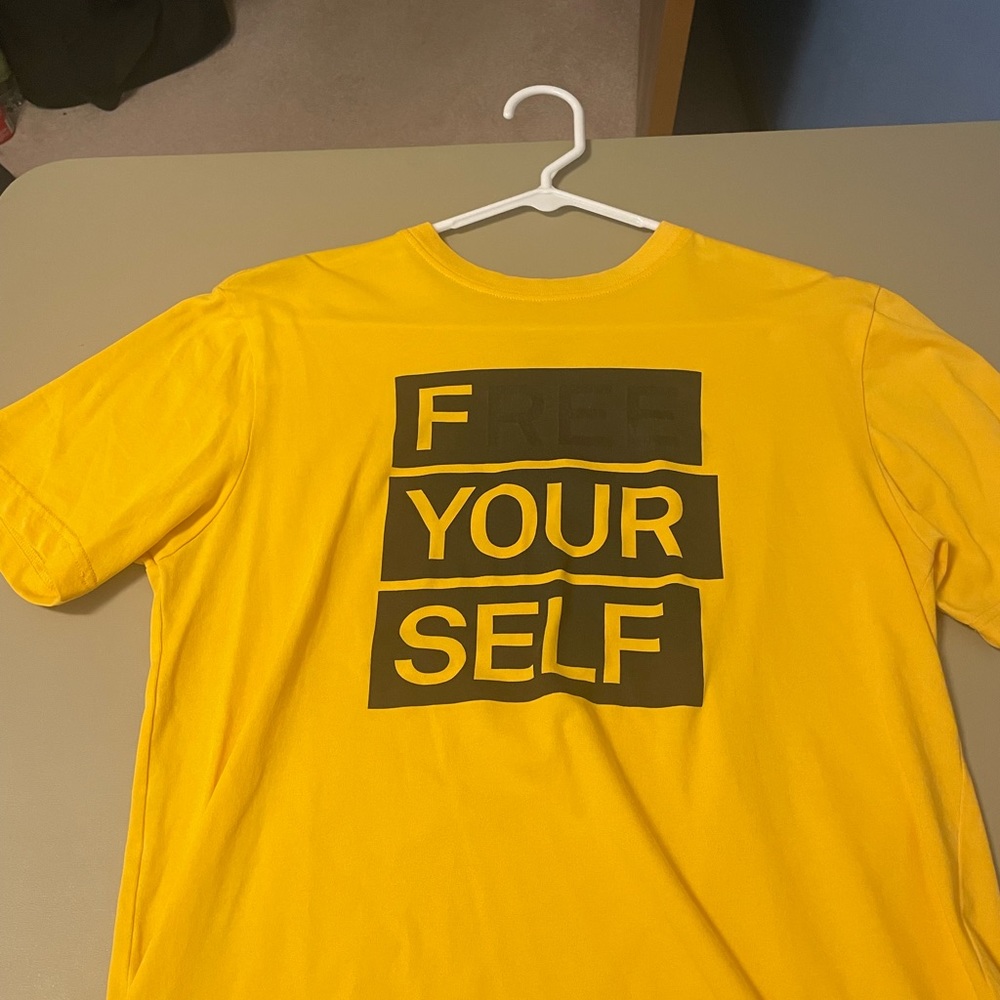 Yellow Nike dri-fit “F(ree) your self” with ree in free faded t-shirt.